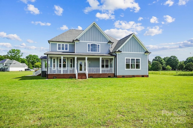 3707 Seagrave Farm Rd, Concord, NC 28025 - back of property with board and batten siding, crawl space, a porch, and a yard