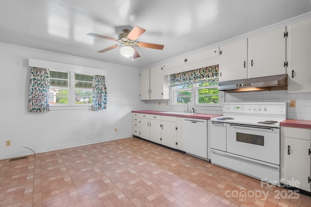 kitchen with white appliances, under cabinet range hood, ceiling fan, white cabinets, and backsplash