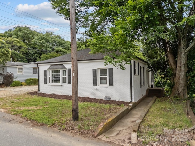 207 Eden St, Davidson, NC 28036 - view of property exterior featuring brick siding, crawl space, and roof with shingles