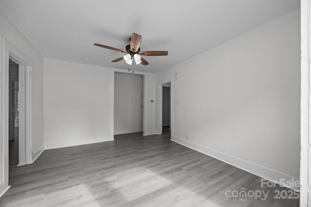 207 Eden St, Davidson, NC 28036 - unfurnished bedroom featuring wood finished floors, a closet, ornamental molding, baseboards, and a ceiling fan