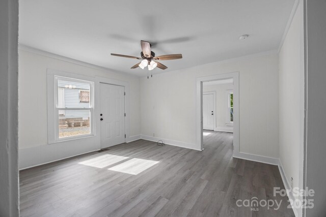 207 Eden St, Davidson, NC 28036 - unfurnished room featuring healthy amount of natural light, wood finished floors, baseboards, and ornamental molding
