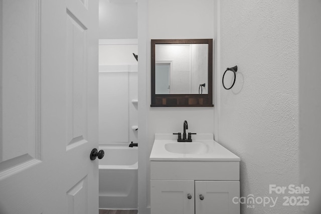 207 Eden St, Davidson, NC 28036 - full bath with vanity, shower / bath combination, and a textured wall