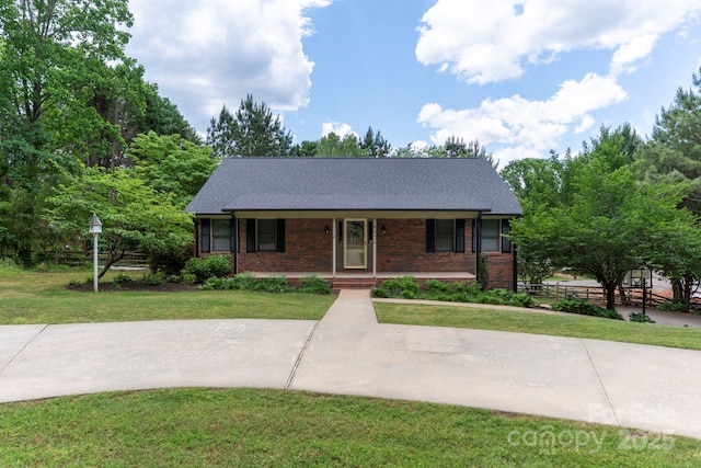 8024 Bradford Ln, Denver, NC 28037 - view of front of home with a porch, brick siding, and a shingled roof
