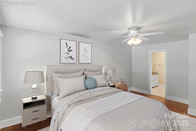 8024 Bradford Ln, Denver, NC 28037 - bedroom featuring baseboards, wood finished floors, connected bathroom, and a ceiling fan