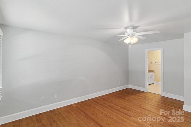 8024 Bradford Ln, Denver, NC 28037 - unfurnished bedroom featuring baseboards, light wood-type flooring, ensuite bathroom, and a ceiling fan