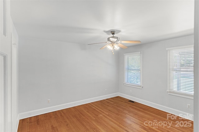 8024 Bradford Ln, Denver, NC 28037 - unfurnished room with a ceiling fan, baseboards, and wood finished floors