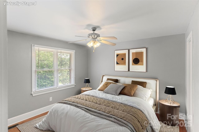 8024 Bradford Ln, Denver, NC 28037 - bedroom with baseboards, wood finished floors, and a ceiling fan