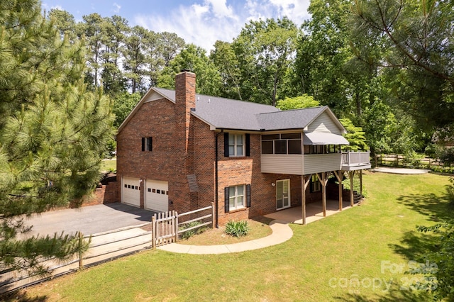 8024 Bradford Ln, Denver, NC 28037 - back of property featuring a garage, driveway, a chimney, brick siding, and a wooden deck