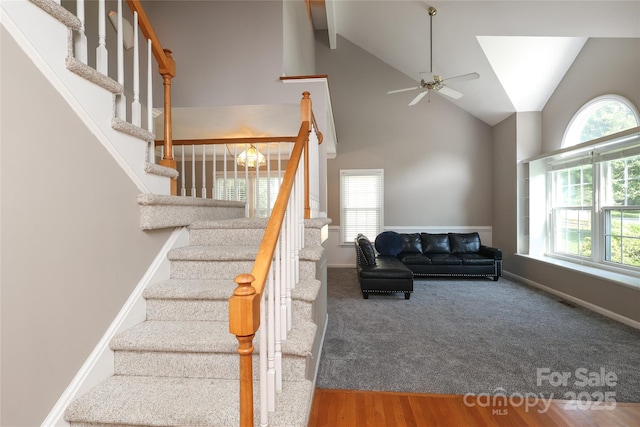 9315 Pebble Creek Way, Charlotte, NC 28269 - stairs with healthy amount of natural light, ceiling fan, high vaulted ceiling, baseboards, and beam ceiling