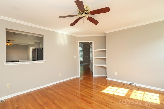 9315 Pebble Creek Way, Charlotte, NC 28269 - spare room with wood finished floors, baseboards, ornamental molding, and a ceiling fan