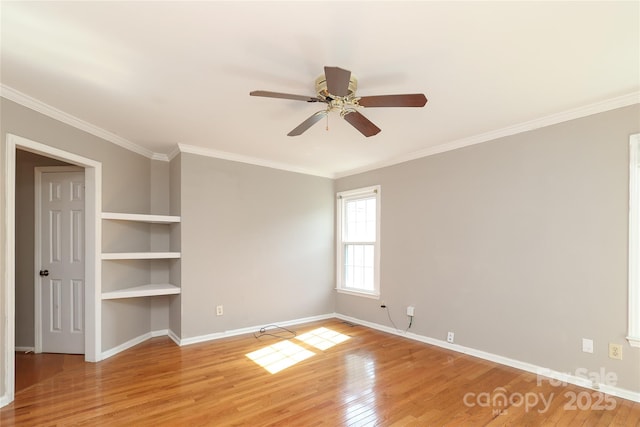 9315 Pebble Creek Way, Charlotte, NC 28269 - unfurnished room featuring light wood-style flooring, baseboards, a ceiling fan, and crown molding
