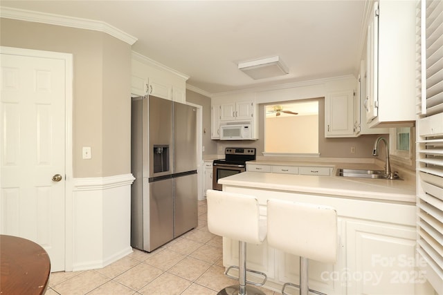 9315 Pebble Creek Way, Charlotte, NC 28269 - kitchen featuring stainless steel appliances, a sink, light countertops, light tile patterned floors, and crown molding