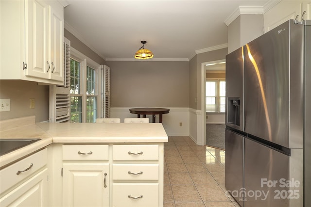 9315 Pebble Creek Way, Charlotte, NC 28269 - kitchen featuring stainless steel refrigerator with ice dispenser, a peninsula, light tile patterned flooring, light countertops, and ornamental molding