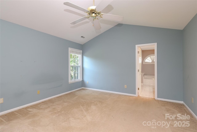 9315 Pebble Creek Way, Charlotte, NC 28269 - spare room with carpet flooring, ceiling fan, vaulted ceiling, and baseboards