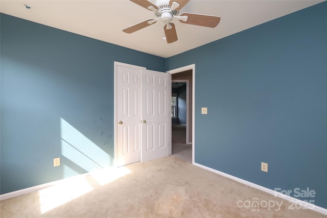 9315 Pebble Creek Way, Charlotte, NC 28269 - unfurnished bedroom featuring carpet, a closet, baseboards, and a ceiling fan