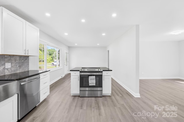 1408 Delview Rd, Cherryville, NC 28021 - kitchen with stainless steel appliances, light wood-style floors, white cabinets, backsplash, and recessed lighting