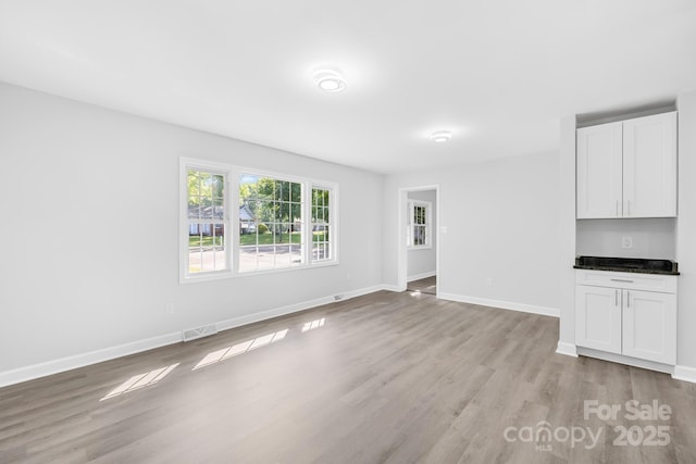 1408 Delview Rd, Cherryville, NC 28021 - unfurnished living room featuring light wood-style floors and baseboards
