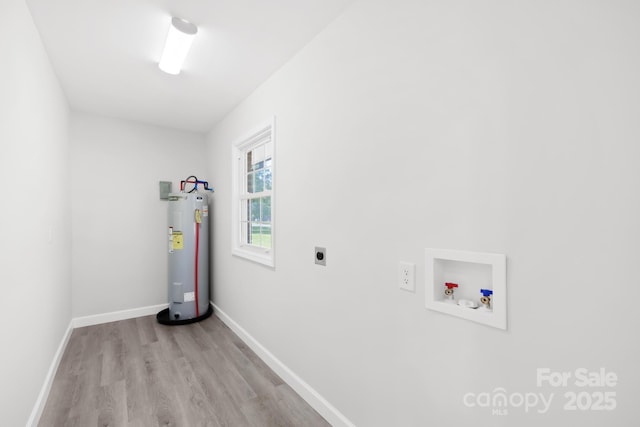 1408 Delview Rd, Cherryville, NC 28021 - laundry room with water heater, hookup for an electric dryer, hookup for a washing machine, and wood finished floors