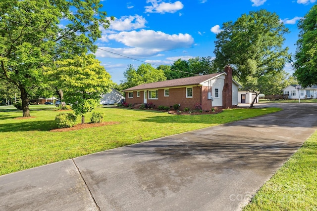 1408 Delview Rd, Cherryville, NC 28021 - view of front of property with brick siding, a chimney, a front yard, and driveway