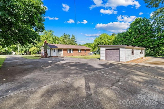 1408 Delview Rd, Cherryville, NC 28021 - view of front facade with an outbuilding, a garage, and a chimney