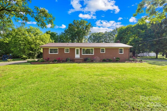 1408 Delview Rd, Cherryville, NC 28021 - single story home with a front lawn, brick siding, a chimney, and entry steps