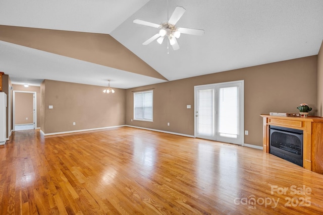 5678 Cedar Run Dr, Denver, NC 28037 - unfurnished living room featuring a fireplace, light wood-type flooring, high vaulted ceiling, ceiling fan, and baseboards
