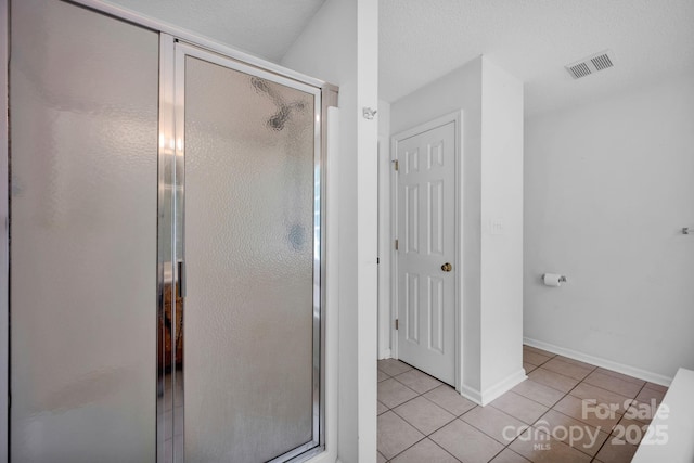 5678 Cedar Run Dr, Denver, NC 28037 - bathroom with tile patterned floors, a stall shower, and baseboards