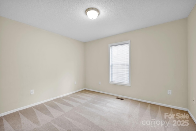 5678 Cedar Run Dr, Denver, NC 28037 - carpeted spare room featuring baseboards and a textured ceiling