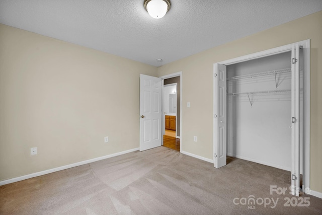 5678 Cedar Run Dr, Denver, NC 28037 - unfurnished bedroom featuring carpet floors, a textured ceiling, baseboards, and a closet