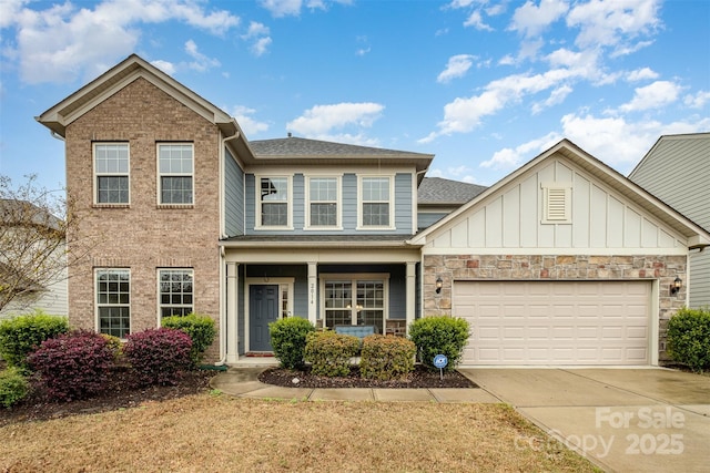 2014 Drawbridge Dr, Fort Mill, SC 29707 - view of front of home featuring concrete driveway, a garage, board and batten siding, and a shingled roof