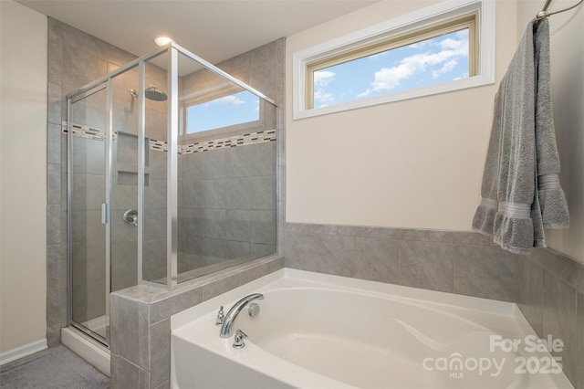 2014 Drawbridge Dr, Fort Mill, SC 29707 - full bathroom featuring a shower stall, a bath, and tile patterned floors