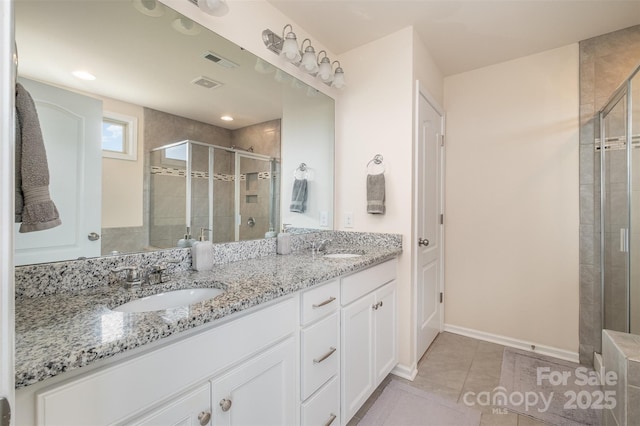 2014 Drawbridge Dr, Fort Mill, SC 29707 - full bath with a stall shower, double vanity, tile patterned floors, and baseboards