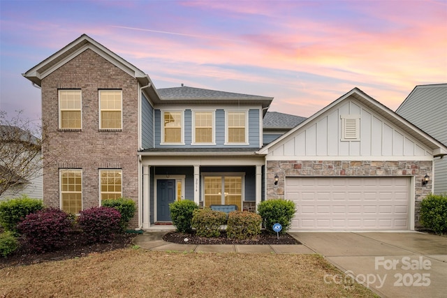 2014 Drawbridge Dr, Fort Mill, SC 29707 - view of front of property featuring concrete driveway, a garage, a shingled roof, a porch, and board and batten siding