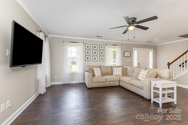 197 Devon Forest Dr, Mooresville, NC 28115 - living room featuring dark wood finished floors, a ceiling fan, baseboards, and crown molding
