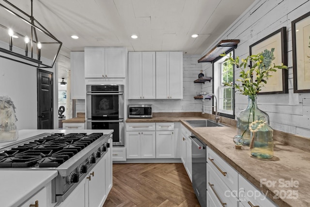 5229 Mt Holly Huntersville Rd, Charlotte, NC 28216 - kitchen featuring appliances with stainless steel finishes, a sink, open shelves, white cabinetry, and recessed lighting
