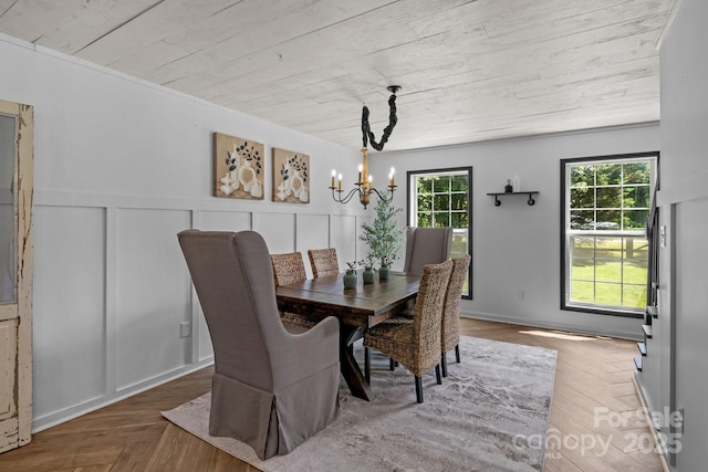 5229 Mt Holly Huntersville Rd, Charlotte, NC 28216 - dining space with a chandelier, a decorative wall, a wainscoted wall, and wood ceiling