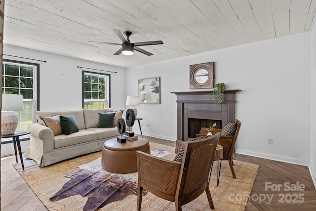 5229 Mt Holly Huntersville Rd, Charlotte, NC 28216 - living area with a ceiling fan, a tile fireplace, and baseboards