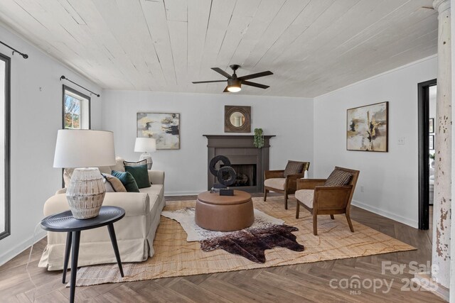 5229 Mt Holly Huntersville Rd, Charlotte, NC 28216 - living room featuring ceiling fan, a fireplace, wood ceiling, and baseboards