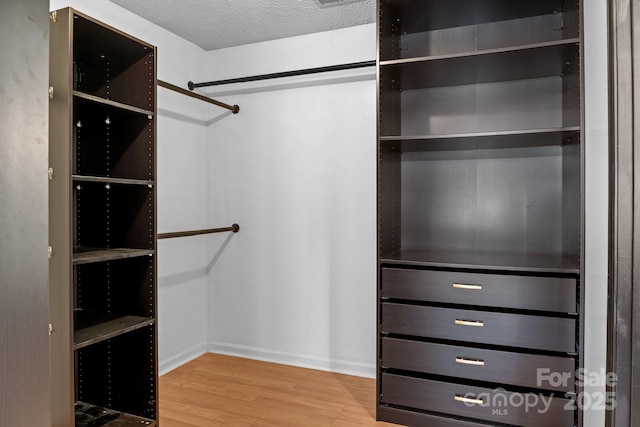 5229 Mt Holly Huntersville Rd, Charlotte, NC 28216 - walk in closet featuring wood finished floors