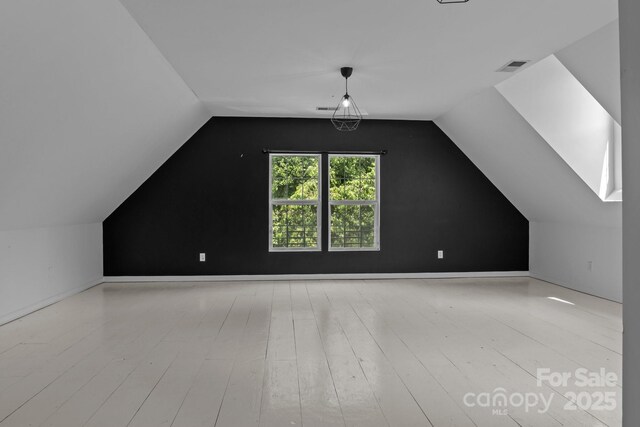 5229 Mt Holly Huntersville Rd, Charlotte, NC 28216 - bonus room with vaulted ceiling and wood finished floors