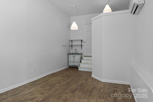 5229 Mt Holly Huntersville Rd, Charlotte, NC 28216 - unfurnished dining area featuring dark wood-style floors, baseboards, and an AC wall unit