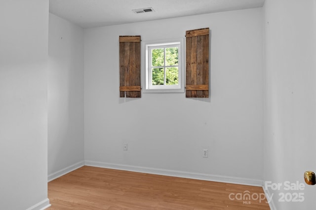 5229 Mt Holly Huntersville Rd, Charlotte, NC 28216 - unfurnished room with wood finished floors and baseboards