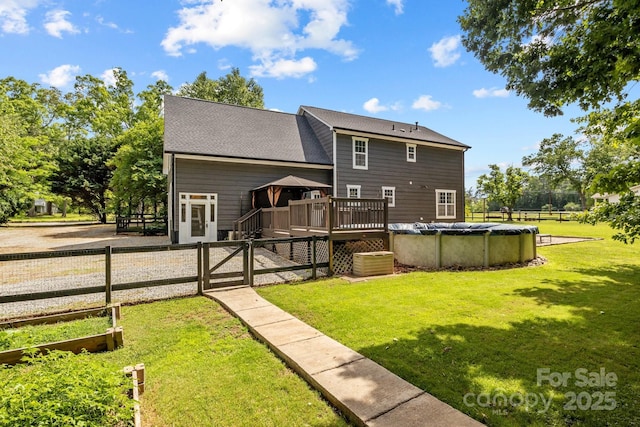 5229 Mt Holly Huntersville Rd, Charlotte, NC 28216 - rear view of house featuring a deck, a gate, and a covered pool