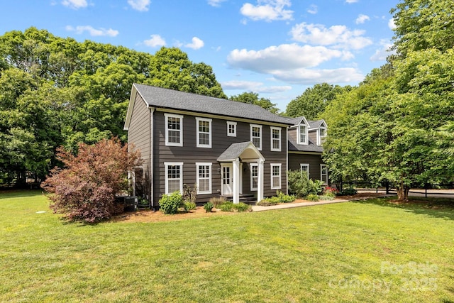 5229 Mt Holly Huntersville Rd, Charlotte, NC 28216 - colonial inspired home with a front yard and roof with shingles