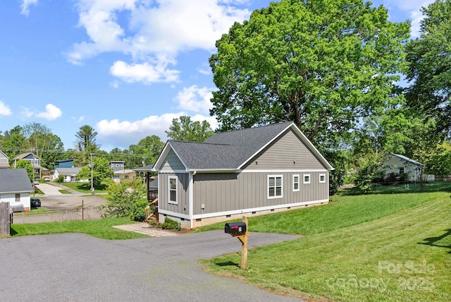 7 Lola Lilly Pl, Asheville, NC 28803 - view of side of home with crawl space, a lawn, roof with shingles, and board and batten siding