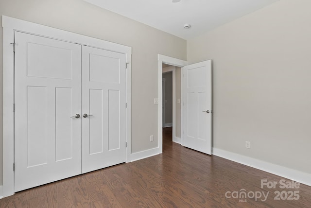 7 Lola Lilly Pl, Asheville, NC 28803 - unfurnished bedroom featuring wood finished floors, baseboards, and a closet