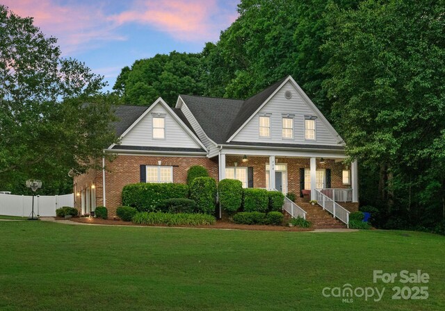 328 Whippoorwill Rd, Mooresville, NC 28117 - view of front of home with covered porch and brick siding