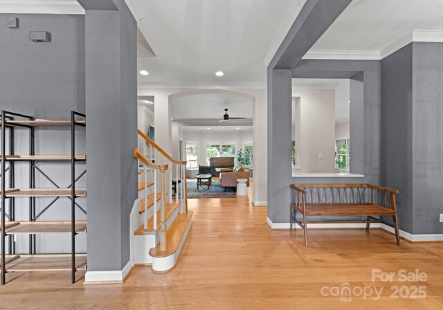 328 Whippoorwill Rd, Mooresville, NC 28117 - entryway featuring a ceiling fan, stairway, wood finished floors, arched walkways, and baseboards