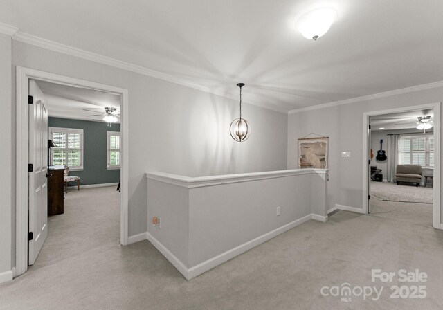 328 Whippoorwill Rd, Mooresville, NC 28117 - hallway featuring an upstairs landing, crown molding, carpet flooring, and baseboards
