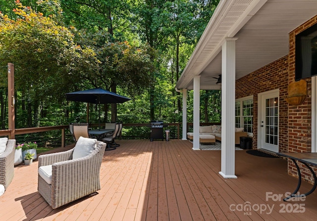 328 Whippoorwill Rd, Mooresville, NC 28117 - wooden deck with an outdoor living space, ceiling fan, and outdoor dining area